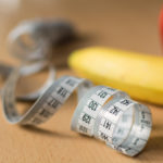 Measuring tape and fruits