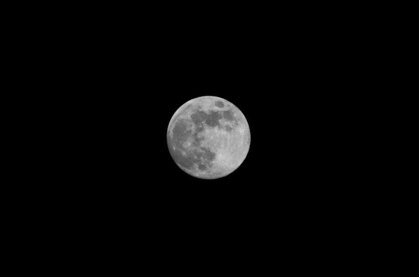 Photo of isolated moon on black background.
