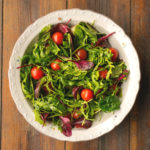 Vegetable salad on wooden table Vegetable salad in white plate on wooden table