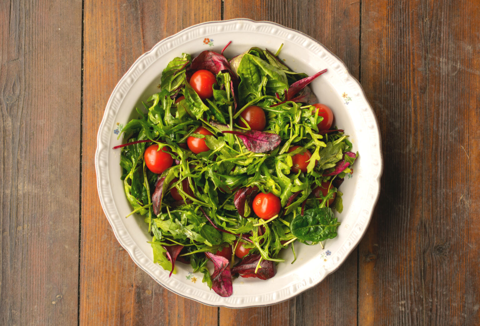 vegetable-salad-in-whit-plate-on-wooden-table-1536x1042.jpg