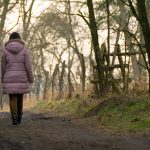 Woman Walking In Forest Woman walking in forest