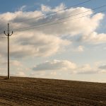 Electric Pole in the Plowed Field Electric pole in brown fields