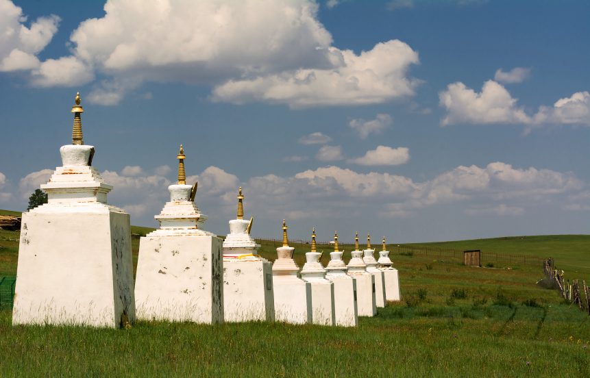 Buddhist stupas in Mongolian green steppe