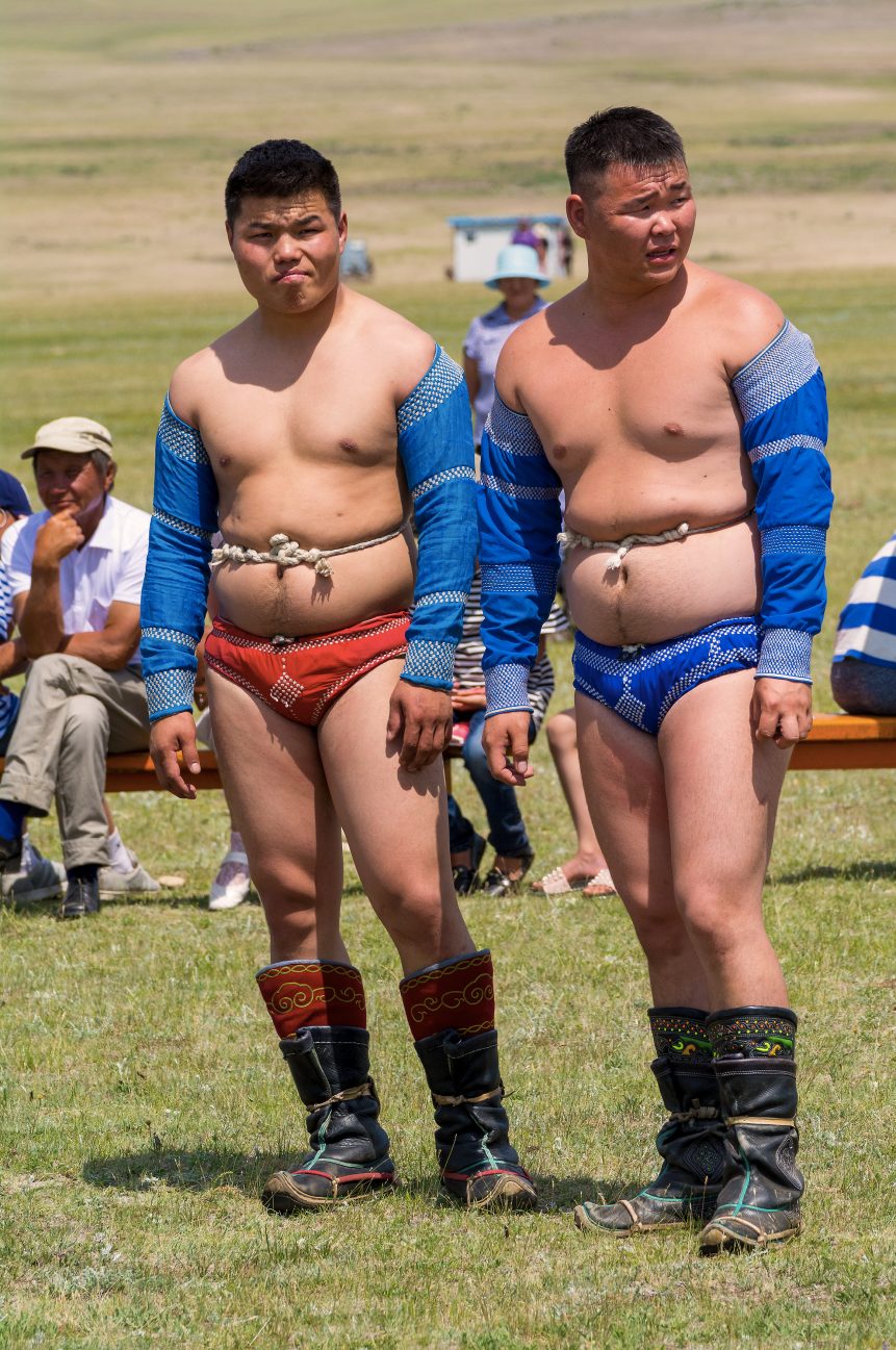 Two wrestlers in a traditional Mongolian sports suit.