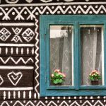 Blue window on painted wooden house