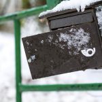 Broken snowy mailbox