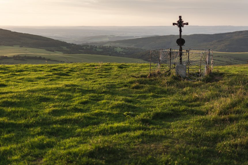 Cross on the green meadow
