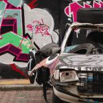 Destroyed car painted with graffiti