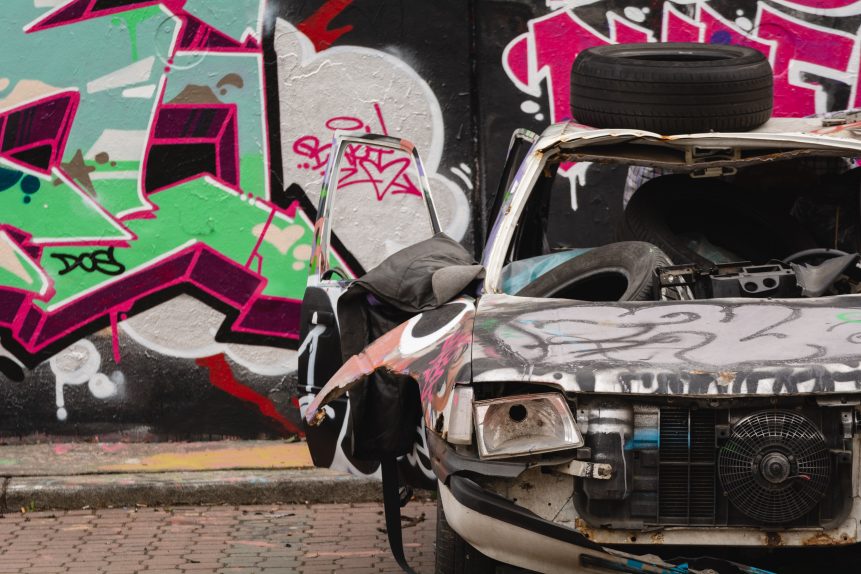 Destroyed car painted with graffiti