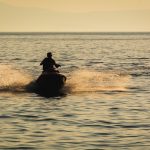 Jet ski on the sea at sunset