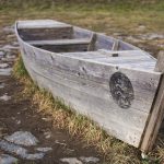 Abandoned Wooden Boat on Land Abandoned wooden boat on land