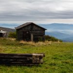 Old wooden log cabin in the mountains.